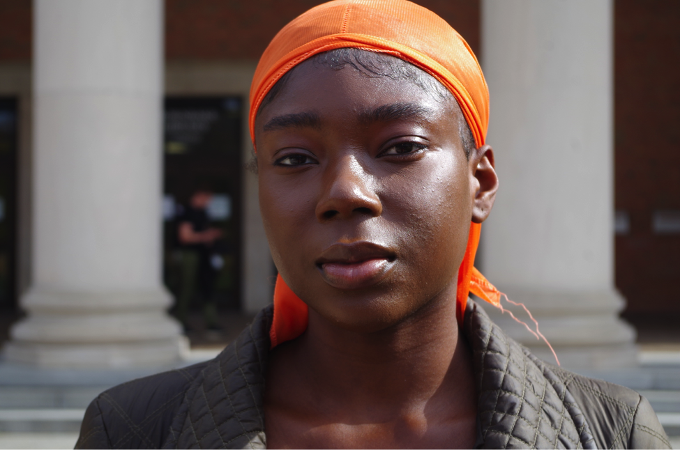 Maud Acheampong rocks an orange durag for fashion, style and an embrace of black culture. Photo by Aleah Green.