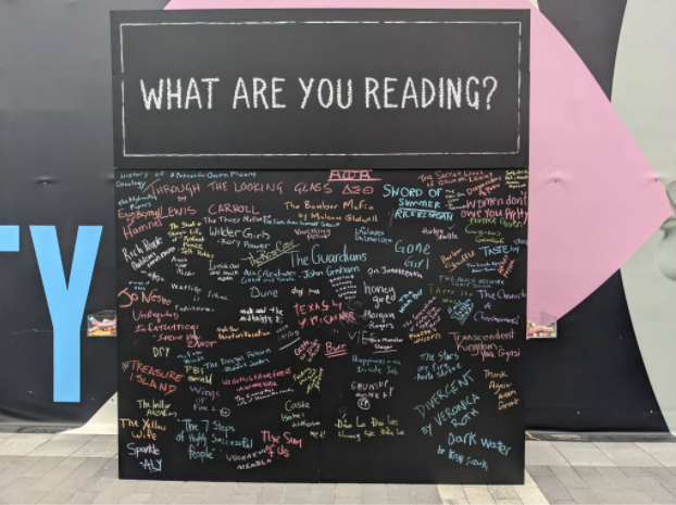 Wall of books that Back in Bloom attendees are reading (Aaron Wright/The Black Explosion)
