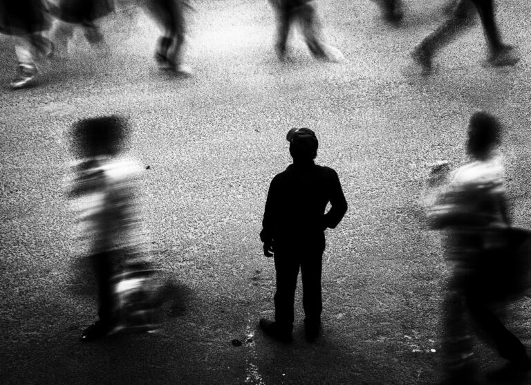 people on a crowded street in black and white
